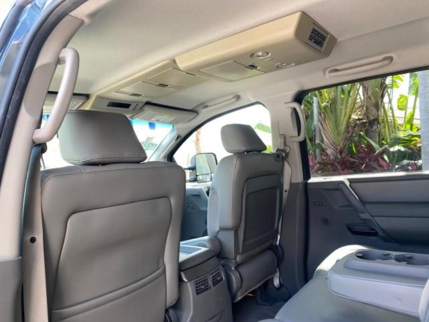 2007 Majestic Blue /Graphite/Titanium Nissan Titan LE 1 OWNER LOW MILES 39,670 CREW CAB (1N6BA07A67N) with an 5.6L DOHC 32-Valve V8 FFV Engine engine, Automatic transmission, located at 4701 North Dixie Hwy, Pompano Beach, FL, 33064, (954) 422-2889, 26.240938, -80.123474 - OUR WEBPAGE FLORIDACARS1.COM HAS OVER 100 PHOTOS AND FREE CARFAX LINK 2007 NISSAN TITAN LE FFV 1 OWNER CREW CAB LEATHER VIN: 1N6BA07A67N215171 1 N 6 B A 0 7 A 6 7 N 2 1 5 1 7 1 CREW PICKUP 5.6L V8 F DOHC 32V FLEX FUEL 19 MPG REAR WHEEL DRIVE Features ABS Brakes Air Conditioning Alloy Wheels AM/FM St - Photo#85