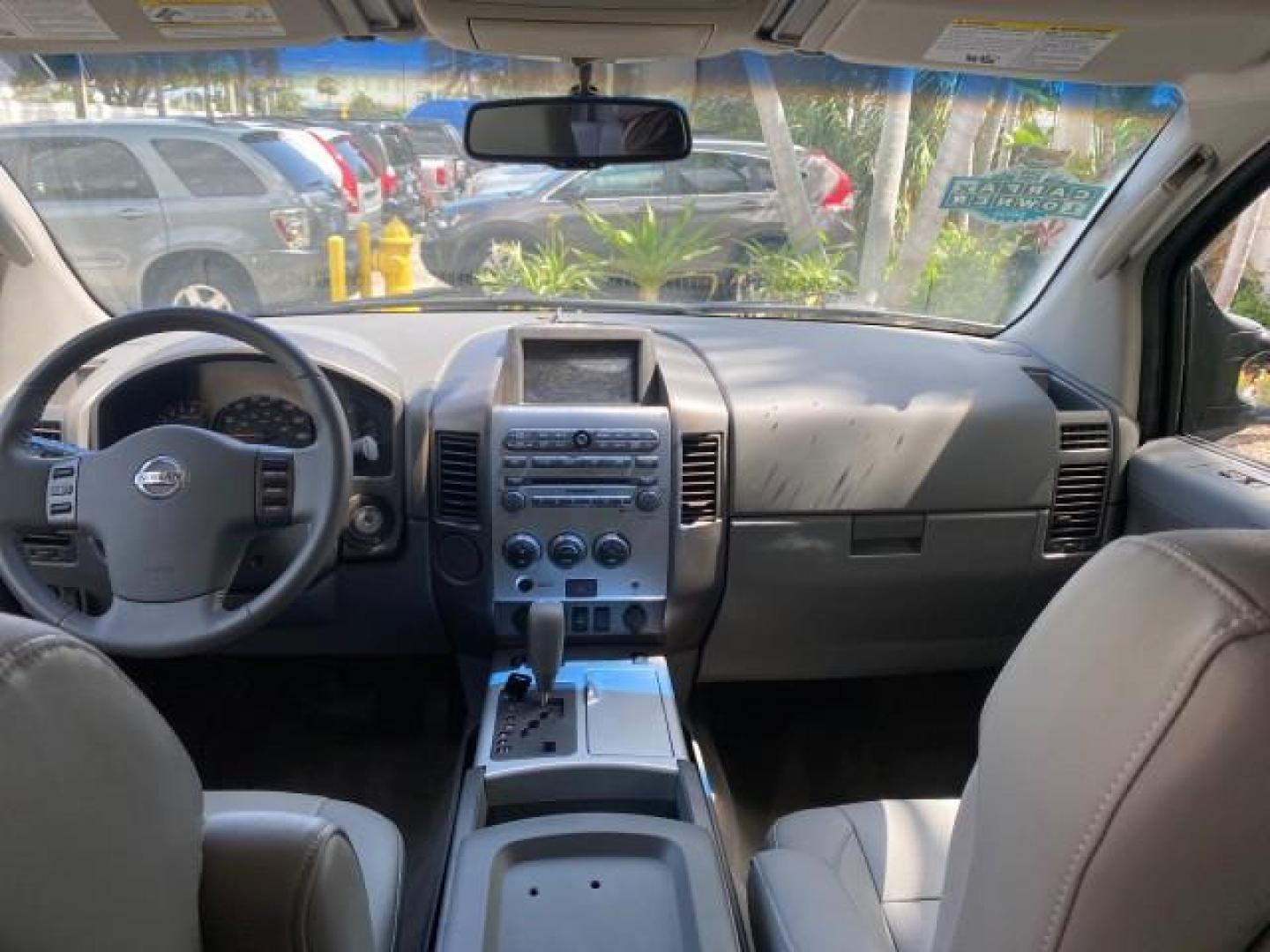 2007 Majestic Blue /Graphite/Titanium Nissan Titan LE 1 OWNER LOW MILES 39,670 CREW CAB (1N6BA07A67N) with an 5.6L DOHC 32-Valve V8 FFV Engine engine, Automatic transmission, located at 4701 North Dixie Hwy, Pompano Beach, FL, 33064, (954) 422-2889, 26.240938, -80.123474 - OUR WEBPAGE FLORIDACARS1.COM HAS OVER 100 PHOTOS AND FREE CARFAX LINK 2007 NISSAN TITAN LE FFV 1 OWNER CREW CAB LEATHER VIN: 1N6BA07A67N215171 1 N 6 B A 0 7 A 6 7 N 2 1 5 1 7 1 CREW PICKUP 5.6L V8 F DOHC 32V FLEX FUEL 19 MPG REAR WHEEL DRIVE Features ABS Brakes Air Conditioning Alloy Wheels AM/FM St - Photo#87