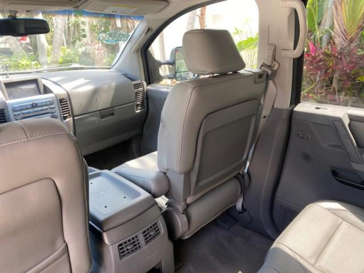 2007 Majestic Blue /Graphite/Titanium Nissan Titan LE 1 OWNER LOW MILES 39,670 CREW CAB (1N6BA07A67N) with an 5.6L DOHC 32-Valve V8 FFV Engine engine, Automatic transmission, located at 4701 North Dixie Hwy, Pompano Beach, FL, 33064, (954) 422-2889, 26.240938, -80.123474 - OUR WEBPAGE FLORIDACARS1.COM HAS OVER 100 PHOTOS AND FREE CARFAX LINK 2007 NISSAN TITAN LE FFV 1 OWNER CREW CAB LEATHER VIN: 1N6BA07A67N215171 1 N 6 B A 0 7 A 6 7 N 2 1 5 1 7 1 CREW PICKUP 5.6L V8 F DOHC 32V FLEX FUEL 19 MPG REAR WHEEL DRIVE Features ABS Brakes Air Conditioning Alloy Wheels AM/FM St - Photo#92