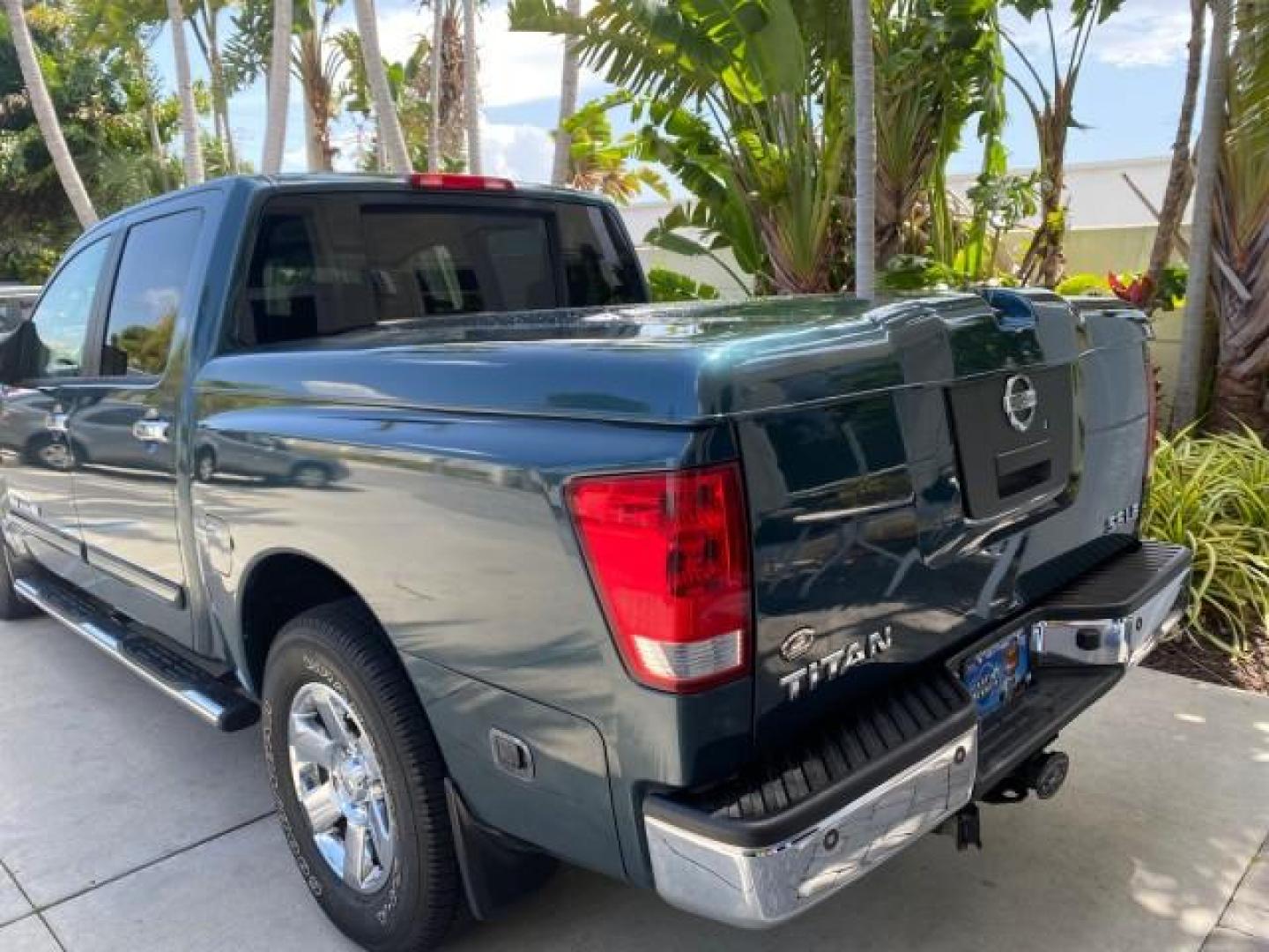 2007 Majestic Blue /Graphite/Titanium Nissan Titan LE 1 OWNER LOW MILES 39,670 CREW CAB (1N6BA07A67N) with an 5.6L DOHC 32-Valve V8 FFV Engine engine, Automatic transmission, located at 4701 North Dixie Hwy, Pompano Beach, FL, 33064, (954) 422-2889, 26.240938, -80.123474 - OUR WEBPAGE FLORIDACARS1.COM HAS OVER 100 PHOTOS AND FREE CARFAX LINK 2007 NISSAN TITAN LE FFV 1 OWNER CREW CAB LEATHER VIN: 1N6BA07A67N215171 1 N 6 B A 0 7 A 6 7 N 2 1 5 1 7 1 CREW PICKUP 5.6L V8 F DOHC 32V FLEX FUEL 19 MPG REAR WHEEL DRIVE Features ABS Brakes Air Conditioning Alloy Wheels AM/FM St - Photo#98