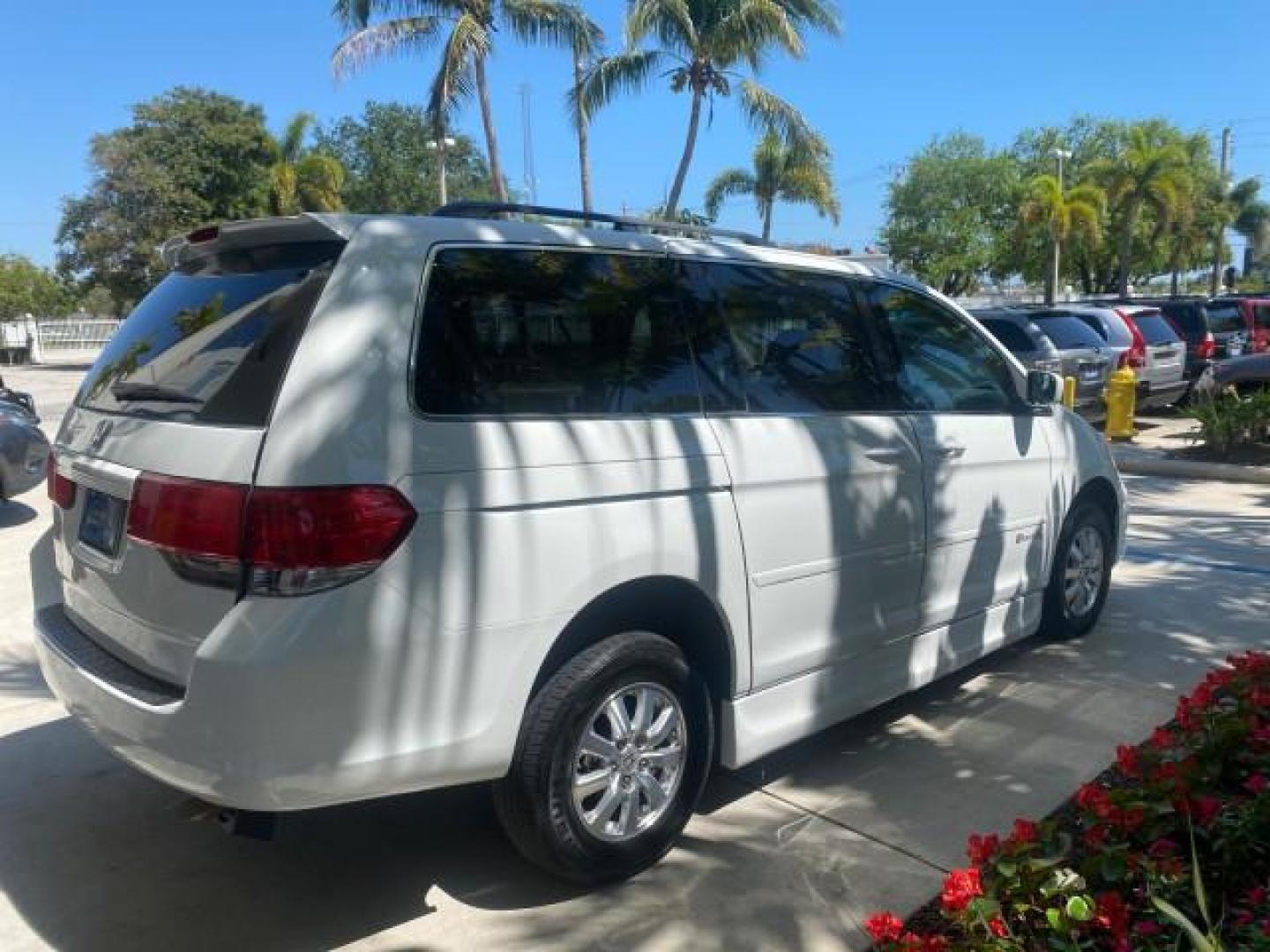 2010 Taffeta White /Ivory Honda Odyssey EX-L LOW MILES 58,506 1 OWNER BRAUN (5FNRL3H68AB) with an 3.5L SOHC MPFI 24-Valve i-VTEC V6 Engine engine, Automatic transmission, located at 4701 North Dixie Hwy, Pompano Beach, FL, 33064, (954) 422-2889, 26.240938, -80.123474 - OUR WEBPAGE FLORIDACARS1.COM HAS OVER 100 PHOTOS AND FREE CARFAX LINK 2010 HONDA ODYSSEY EX-L 1 OWNER BRAUN HANDICAP CONVERSION VAN NEW $33,544 VIN: 5FNRL3H68AB090445 5 F N R L 3 H 6 8 A B 0 9 0 4 4 5 VAN 3.5L V6 F SOHC 24V GASOLINE 25 MPG FRONT WHEEL DRIVE Features ABS Brakes Air Conditioning Alloy- Photo#7