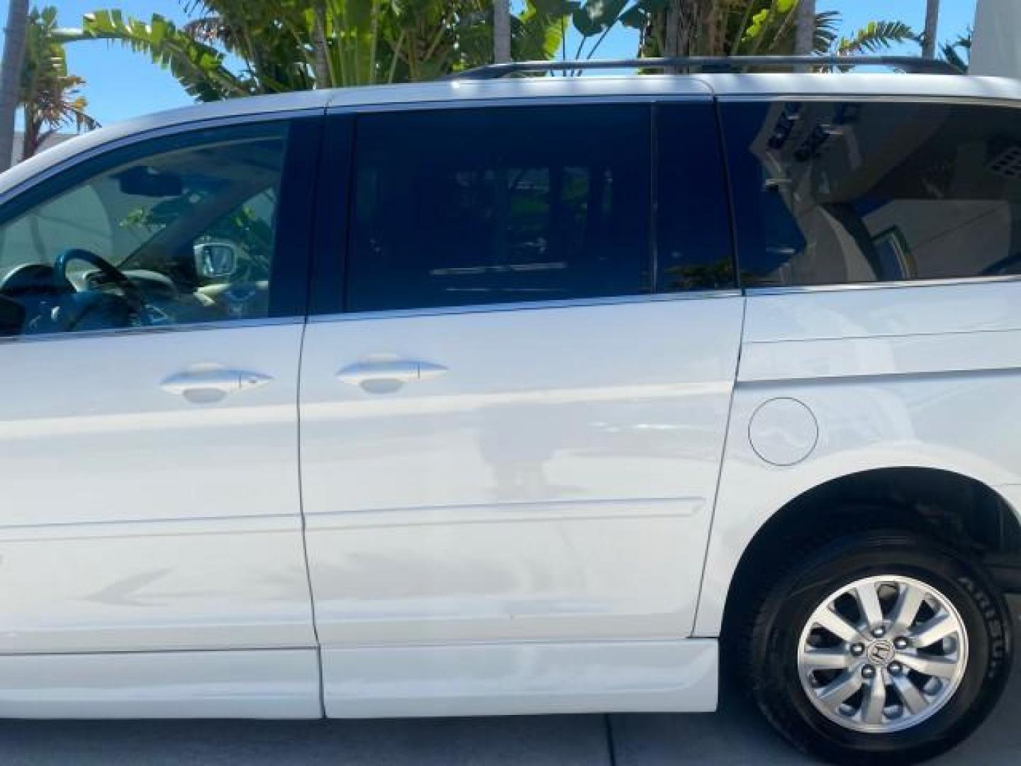 2010 Taffeta White /Ivory Honda Odyssey EX-L LOW MILES 58,506 1 OWNER BRAUN (5FNRL3H68AB) with an 3.5L SOHC MPFI 24-Valve i-VTEC V6 Engine engine, Automatic transmission, located at 4701 North Dixie Hwy, Pompano Beach, FL, 33064, (954) 422-2889, 26.240938, -80.123474 - OUR WEBPAGE FLORIDACARS1.COM HAS OVER 100 PHOTOS AND FREE CARFAX LINK 2010 HONDA ODYSSEY EX-L 1 OWNER BRAUN HANDICAP CONVERSION VAN NEW $33,544 VIN: 5FNRL3H68AB090445 5 F N R L 3 H 6 8 A B 0 9 0 4 4 5 VAN 3.5L V6 F SOHC 24V GASOLINE 25 MPG FRONT WHEEL DRIVE Features ABS Brakes Air Conditioning Alloy- Photo#75
