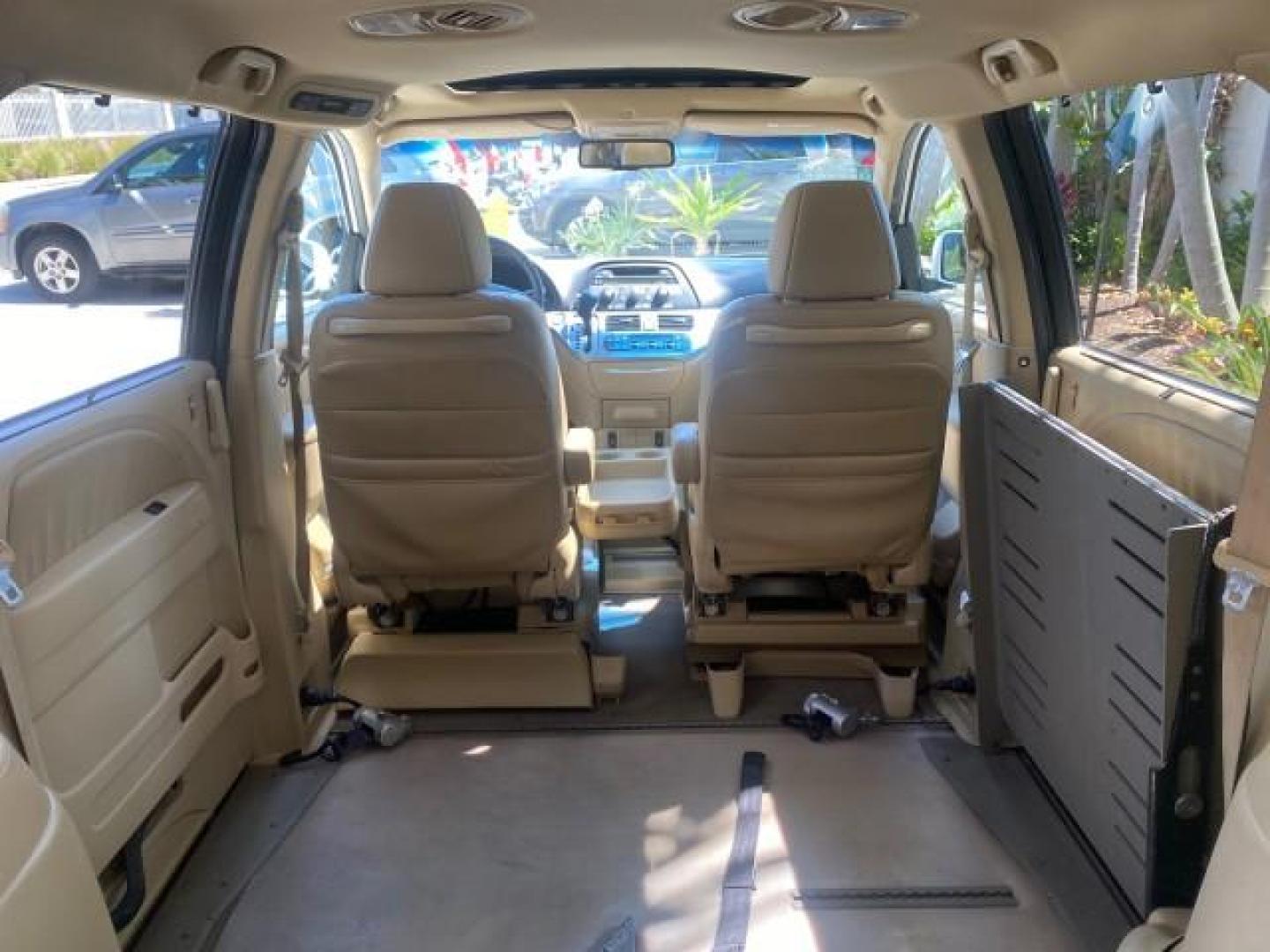 2010 Taffeta White /Ivory Honda Odyssey EX-L LOW MILES 58,506 1 OWNER BRAUN (5FNRL3H68AB) with an 3.5L SOHC MPFI 24-Valve i-VTEC V6 Engine engine, Automatic transmission, located at 4701 North Dixie Hwy, Pompano Beach, FL, 33064, (954) 422-2889, 26.240938, -80.123474 - OUR WEBPAGE FLORIDACARS1.COM HAS OVER 100 PHOTOS AND FREE CARFAX LINK 2010 HONDA ODYSSEY EX-L 1 OWNER BRAUN HANDICAP CONVERSION VAN NEW $33,544 VIN: 5FNRL3H68AB090445 5 F N R L 3 H 6 8 A B 0 9 0 4 4 5 VAN 3.5L V6 F SOHC 24V GASOLINE 25 MPG FRONT WHEEL DRIVE Features ABS Brakes Air Conditioning Alloy- Photo#99