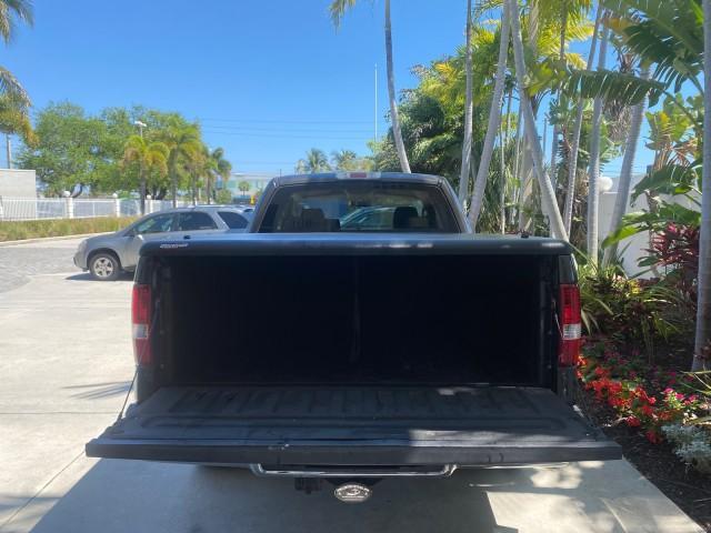 2006 Black /Tan Ford F-150 XLT LOW MILES 61,649 (1FTPX12596N) with an 5.4L 3v EFI V8 Engine engine, Automatic transmission, located at 4701 North Dixie Hwy, Pompano Beach, FL, 33064, (954) 422-2889, 26.240938, -80.123474 - OUR WEBPAGE FLORIDACARS1.COM HAS OVER 100 PHOTOS AND FREE CARFAX LINK 2006 FORD F-150 XLT 6.5 FT BED LOADED VERY HANDY FOR WORK VIN: 1FTPX12596NA02804 1 F T P X 1 2 5 9 6 N A 0 2 8 0 4 4 DOOR EXTENDED CAB PICKUP 5.4L V8 F SOHC GASOLINE 19 MPG REAR WHEEL DRIVE Features ABS Brakes Air Conditioning All - Photo#89
