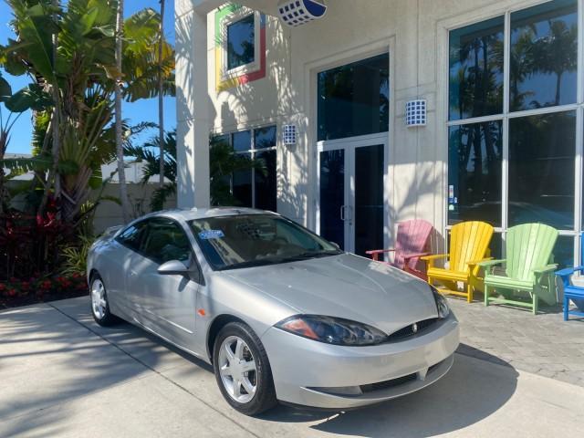 1999 Silver Frost Metallic /Greystone Mercury Cougar 3DR HATCH LOW MILES 28,846 (1ZWFT61L0X5) with an 2.5L DOHC SEFI 24-Valve V6 Duratec Engine engine, Automatic transmission, located at 4701 North Dixie Hwy, Pompano Beach, FL, 33064, (954) 422-2889, 26.240938, -80.123474 - OUR WEBPAGE FLORIDACARS1.COM HAS OVER 100 PHOTOS AND FREE CARFAX LINK 1999 MERCURY COUGAR VIN: 1ZWFT61L0X5611052 1 Z W F T 6 1 L 0 X 5 6 1 1 0 5 2 HATCHBACK 2 DR 2.5L V6 F DOHC 24V GASOLINE 30 MPG FRONT WHEEL DRIVE Features Air Conditioning Alloy Wheels AM/FM Stereo Automatic Transmission Cassette P - Photo#1