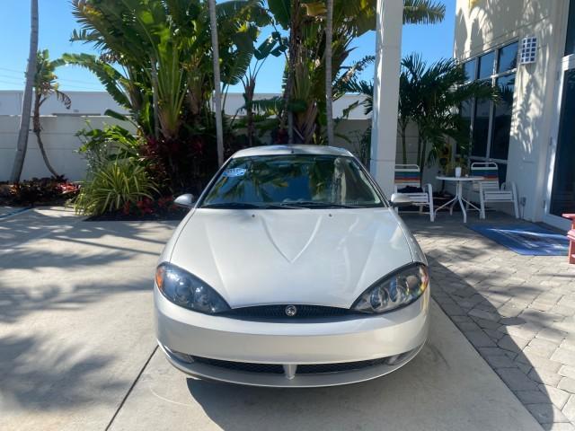 1999 Silver Frost Metallic /Greystone Mercury Cougar 3DR HATCH LOW MILES 28,846 (1ZWFT61L0X5) with an 2.5L DOHC SEFI 24-Valve V6 Duratec Engine engine, Automatic transmission, located at 4701 North Dixie Hwy, Pompano Beach, FL, 33064, (954) 422-2889, 26.240938, -80.123474 - OUR WEBPAGE FLORIDACARS1.COM HAS OVER 100 PHOTOS AND FREE CARFAX LINK 1999 MERCURY COUGAR VIN: 1ZWFT61L0X5611052 1 Z W F T 6 1 L 0 X 5 6 1 1 0 5 2 HATCHBACK 2 DR 2.5L V6 F DOHC 24V GASOLINE 30 MPG FRONT WHEEL DRIVE Features Air Conditioning Alloy Wheels AM/FM Stereo Automatic Transmission Cassette P - Photo#2