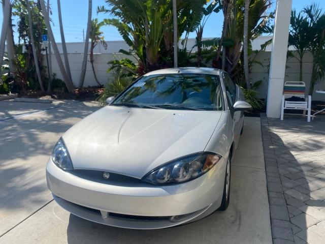 1999 Silver Frost Metallic /Greystone Mercury Cougar 3DR HATCH LOW MILES 28,846 (1ZWFT61L0X5) with an 2.5L DOHC SEFI 24-Valve V6 Duratec Engine engine, Automatic transmission, located at 4701 North Dixie Hwy, Pompano Beach, FL, 33064, (954) 422-2889, 26.240938, -80.123474 - OUR WEBPAGE FLORIDACARS1.COM HAS OVER 100 PHOTOS AND FREE CARFAX LINK 1999 MERCURY COUGAR VIN: 1ZWFT61L0X5611052 1 Z W F T 6 1 L 0 X 5 6 1 1 0 5 2 HATCHBACK 2 DR 2.5L V6 F DOHC 24V GASOLINE 30 MPG FRONT WHEEL DRIVE Features Air Conditioning Alloy Wheels AM/FM Stereo Automatic Transmission Cassette P - Photo#3