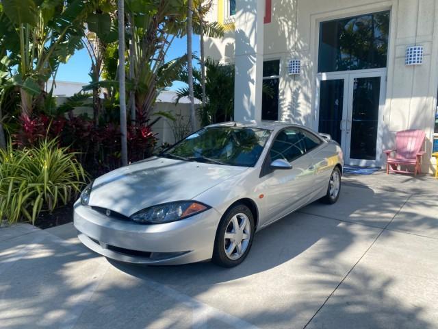 1999 Silver Frost Metallic /Greystone Mercury Cougar 3DR HATCH LOW MILES 28,846 (1ZWFT61L0X5) with an 2.5L DOHC SEFI 24-Valve V6 Duratec Engine engine, Automatic transmission, located at 4701 North Dixie Hwy, Pompano Beach, FL, 33064, (954) 422-2889, 26.240938, -80.123474 - OUR WEBPAGE FLORIDACARS1.COM HAS OVER 100 PHOTOS AND FREE CARFAX LINK 1999 MERCURY COUGAR VIN: 1ZWFT61L0X5611052 1 Z W F T 6 1 L 0 X 5 6 1 1 0 5 2 HATCHBACK 2 DR 2.5L V6 F DOHC 24V GASOLINE 30 MPG FRONT WHEEL DRIVE Features Air Conditioning Alloy Wheels AM/FM Stereo Automatic Transmission Cassette P - Photo#28