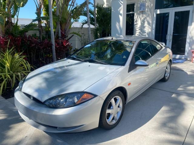 1999 Silver Frost Metallic /Greystone Mercury Cougar 3DR HATCH LOW MILES 28,846 (1ZWFT61L0X5) with an 2.5L DOHC SEFI 24-Valve V6 Duratec Engine engine, Automatic transmission, located at 4701 North Dixie Hwy, Pompano Beach, FL, 33064, (954) 422-2889, 26.240938, -80.123474 - OUR WEBPAGE FLORIDACARS1.COM HAS OVER 100 PHOTOS AND FREE CARFAX LINK 1999 MERCURY COUGAR VIN: 1ZWFT61L0X5611052 1 Z W F T 6 1 L 0 X 5 6 1 1 0 5 2 HATCHBACK 2 DR 2.5L V6 F DOHC 24V GASOLINE 30 MPG FRONT WHEEL DRIVE Features Air Conditioning Alloy Wheels AM/FM Stereo Automatic Transmission Cassette P - Photo#29