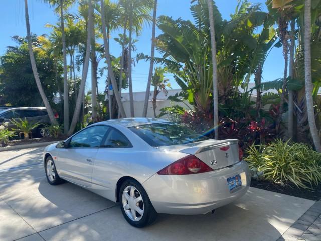 1999 Silver Frost Metallic /Greystone Mercury Cougar 3DR HATCH LOW MILES 28,846 (1ZWFT61L0X5) with an 2.5L DOHC SEFI 24-Valve V6 Duratec Engine engine, Automatic transmission, located at 4701 North Dixie Hwy, Pompano Beach, FL, 33064, (954) 422-2889, 26.240938, -80.123474 - OUR WEBPAGE FLORIDACARS1.COM HAS OVER 100 PHOTOS AND FREE CARFAX LINK 1999 MERCURY COUGAR VIN: 1ZWFT61L0X5611052 1 Z W F T 6 1 L 0 X 5 6 1 1 0 5 2 HATCHBACK 2 DR 2.5L V6 F DOHC 24V GASOLINE 30 MPG FRONT WHEEL DRIVE Features Air Conditioning Alloy Wheels AM/FM Stereo Automatic Transmission Cassette P - Photo#32