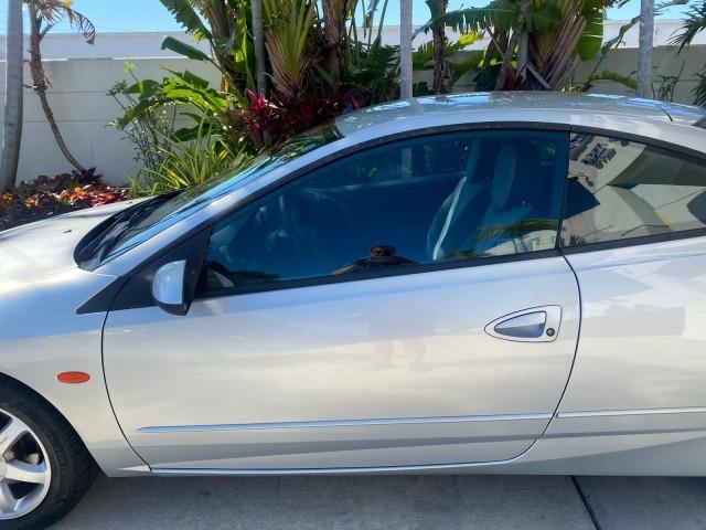 1999 Silver Frost Metallic /Greystone Mercury Cougar 3DR HATCH LOW MILES 28,846 (1ZWFT61L0X5) with an 2.5L DOHC SEFI 24-Valve V6 Duratec Engine engine, Automatic transmission, located at 4701 North Dixie Hwy, Pompano Beach, FL, 33064, (954) 422-2889, 26.240938, -80.123474 - OUR WEBPAGE FLORIDACARS1.COM HAS OVER 100 PHOTOS AND FREE CARFAX LINK 1999 MERCURY COUGAR VIN: 1ZWFT61L0X5611052 1 Z W F T 6 1 L 0 X 5 6 1 1 0 5 2 HATCHBACK 2 DR 2.5L V6 F DOHC 24V GASOLINE 30 MPG FRONT WHEEL DRIVE Features Air Conditioning Alloy Wheels AM/FM Stereo Automatic Transmission Cassette P - Photo#37