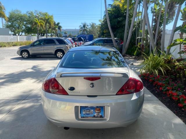 1999 Silver Frost Metallic /Greystone Mercury Cougar 3DR HATCH LOW MILES 28,846 (1ZWFT61L0X5) with an 2.5L DOHC SEFI 24-Valve V6 Duratec Engine engine, Automatic transmission, located at 4701 North Dixie Hwy, Pompano Beach, FL, 33064, (954) 422-2889, 26.240938, -80.123474 - OUR WEBPAGE FLORIDACARS1.COM HAS OVER 100 PHOTOS AND FREE CARFAX LINK 1999 MERCURY COUGAR VIN: 1ZWFT61L0X5611052 1 Z W F T 6 1 L 0 X 5 6 1 1 0 5 2 HATCHBACK 2 DR 2.5L V6 F DOHC 24V GASOLINE 30 MPG FRONT WHEEL DRIVE Features Air Conditioning Alloy Wheels AM/FM Stereo Automatic Transmission Cassette P - Photo#79