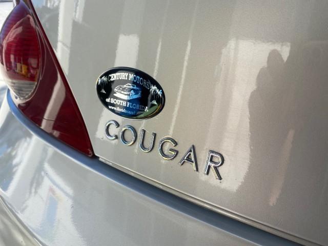 1999 Silver Frost Metallic /Greystone Mercury Cougar 3DR HATCH LOW MILES 28,846 (1ZWFT61L0X5) with an 2.5L DOHC SEFI 24-Valve V6 Duratec Engine engine, Automatic transmission, located at 4701 North Dixie Hwy, Pompano Beach, FL, 33064, (954) 422-2889, 26.240938, -80.123474 - OUR WEBPAGE FLORIDACARS1.COM HAS OVER 100 PHOTOS AND FREE CARFAX LINK 1999 MERCURY COUGAR VIN: 1ZWFT61L0X5611052 1 Z W F T 6 1 L 0 X 5 6 1 1 0 5 2 HATCHBACK 2 DR 2.5L V6 F DOHC 24V GASOLINE 30 MPG FRONT WHEEL DRIVE Features Air Conditioning Alloy Wheels AM/FM Stereo Automatic Transmission Cassette P - Photo#80