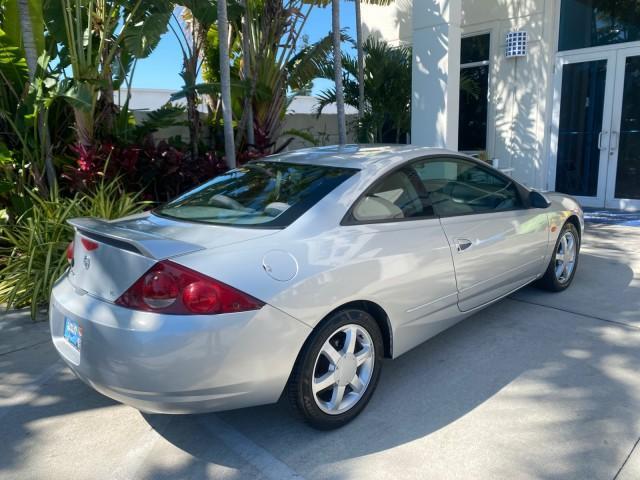 1999 Silver Frost Metallic /Greystone Mercury Cougar 3DR HATCH LOW MILES 28,846 (1ZWFT61L0X5) with an 2.5L DOHC SEFI 24-Valve V6 Duratec Engine engine, Automatic transmission, located at 4701 North Dixie Hwy, Pompano Beach, FL, 33064, (954) 422-2889, 26.240938, -80.123474 - OUR WEBPAGE FLORIDACARS1.COM HAS OVER 100 PHOTOS AND FREE CARFAX LINK 1999 MERCURY COUGAR VIN: 1ZWFT61L0X5611052 1 Z W F T 6 1 L 0 X 5 6 1 1 0 5 2 HATCHBACK 2 DR 2.5L V6 F DOHC 24V GASOLINE 30 MPG FRONT WHEEL DRIVE Features Air Conditioning Alloy Wheels AM/FM Stereo Automatic Transmission Cassette P - Photo#93