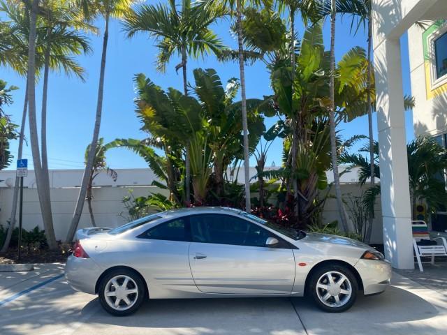 1999 Silver Frost Metallic /Greystone Mercury Cougar 3DR HATCH LOW MILES 28,846 (1ZWFT61L0X5) with an 2.5L DOHC SEFI 24-Valve V6 Duratec Engine engine, Automatic transmission, located at 4701 North Dixie Hwy, Pompano Beach, FL, 33064, (954) 422-2889, 26.240938, -80.123474 - OUR WEBPAGE FLORIDACARS1.COM HAS OVER 100 PHOTOS AND FREE CARFAX LINK 1999 MERCURY COUGAR VIN: 1ZWFT61L0X5611052 1 Z W F T 6 1 L 0 X 5 6 1 1 0 5 2 HATCHBACK 2 DR 2.5L V6 F DOHC 24V GASOLINE 30 MPG FRONT WHEEL DRIVE Features Air Conditioning Alloy Wheels AM/FM Stereo Automatic Transmission Cassette P - Photo#94