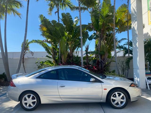 1999 Silver Frost Metallic /Greystone Mercury Cougar 3DR HATCH LOW MILES 28,846 (1ZWFT61L0X5) with an 2.5L DOHC SEFI 24-Valve V6 Duratec Engine engine, Automatic transmission, located at 4701 North Dixie Hwy, Pompano Beach, FL, 33064, (954) 422-2889, 26.240938, -80.123474 - OUR WEBPAGE FLORIDACARS1.COM HAS OVER 100 PHOTOS AND FREE CARFAX LINK 1999 MERCURY COUGAR VIN: 1ZWFT61L0X5611052 1 Z W F T 6 1 L 0 X 5 6 1 1 0 5 2 HATCHBACK 2 DR 2.5L V6 F DOHC 24V GASOLINE 30 MPG FRONT WHEEL DRIVE Features Air Conditioning Alloy Wheels AM/FM Stereo Automatic Transmission Cassette P - Photo#95