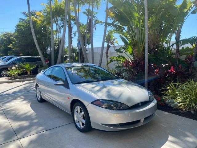 1999 Silver Frost Metallic /Greystone Mercury Cougar 3DR HATCH LOW MILES 28,846 (1ZWFT61L0X5) with an 2.5L DOHC SEFI 24-Valve V6 Duratec Engine engine, Automatic transmission, located at 4701 North Dixie Hwy, Pompano Beach, FL, 33064, (954) 422-2889, 26.240938, -80.123474 - OUR WEBPAGE FLORIDACARS1.COM HAS OVER 100 PHOTOS AND FREE CARFAX LINK 1999 MERCURY COUGAR VIN: 1ZWFT61L0X5611052 1 Z W F T 6 1 L 0 X 5 6 1 1 0 5 2 HATCHBACK 2 DR 2.5L V6 F DOHC 24V GASOLINE 30 MPG FRONT WHEEL DRIVE Features Air Conditioning Alloy Wheels AM/FM Stereo Automatic Transmission Cassette P - Photo#96