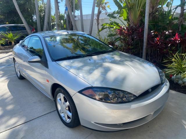 1999 Silver Frost Metallic /Greystone Mercury Cougar 3DR HATCH LOW MILES 28,846 (1ZWFT61L0X5) with an 2.5L DOHC SEFI 24-Valve V6 Duratec Engine engine, Automatic transmission, located at 4701 North Dixie Hwy, Pompano Beach, FL, 33064, (954) 422-2889, 26.240938, -80.123474 - OUR WEBPAGE FLORIDACARS1.COM HAS OVER 100 PHOTOS AND FREE CARFAX LINK 1999 MERCURY COUGAR VIN: 1ZWFT61L0X5611052 1 Z W F T 6 1 L 0 X 5 6 1 1 0 5 2 HATCHBACK 2 DR 2.5L V6 F DOHC 24V GASOLINE 30 MPG FRONT WHEEL DRIVE Features Air Conditioning Alloy Wheels AM/FM Stereo Automatic Transmission Cassette P - Photo#97