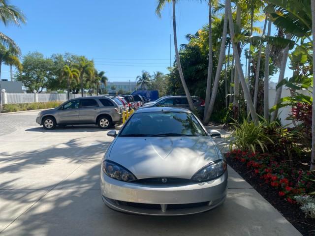 1999 Silver Frost Metallic /Greystone Mercury Cougar 3DR HATCH LOW MILES 28,846 (1ZWFT61L0X5) with an 2.5L DOHC SEFI 24-Valve V6 Duratec Engine engine, Automatic transmission, located at 4701 North Dixie Hwy, Pompano Beach, FL, 33064, (954) 422-2889, 26.240938, -80.123474 - OUR WEBPAGE FLORIDACARS1.COM HAS OVER 100 PHOTOS AND FREE CARFAX LINK 1999 MERCURY COUGAR VIN: 1ZWFT61L0X5611052 1 Z W F T 6 1 L 0 X 5 6 1 1 0 5 2 HATCHBACK 2 DR 2.5L V6 F DOHC 24V GASOLINE 30 MPG FRONT WHEEL DRIVE Features Air Conditioning Alloy Wheels AM/FM Stereo Automatic Transmission Cassette P - Photo#98