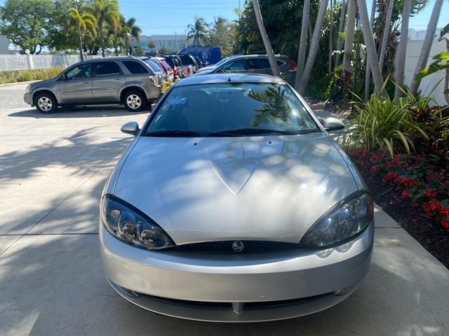 1999 Silver Frost Metallic /Greystone Mercury Cougar 3DR HATCH LOW MILES 28,846 (1ZWFT61L0X5) with an 2.5L DOHC SEFI 24-Valve V6 Duratec Engine engine, Automatic transmission, located at 4701 North Dixie Hwy, Pompano Beach, FL, 33064, (954) 422-2889, 26.240938, -80.123474 - OUR WEBPAGE FLORIDACARS1.COM HAS OVER 100 PHOTOS AND FREE CARFAX LINK 1999 MERCURY COUGAR VIN: 1ZWFT61L0X5611052 1 Z W F T 6 1 L 0 X 5 6 1 1 0 5 2 HATCHBACK 2 DR 2.5L V6 F DOHC 24V GASOLINE 30 MPG FRONT WHEEL DRIVE Features Air Conditioning Alloy Wheels AM/FM Stereo Automatic Transmission Cassette P - Photo#99