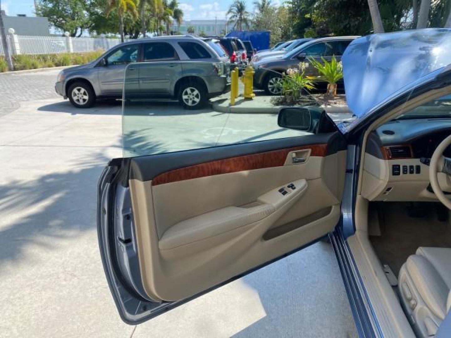 2007 Cosmic Blue Metallic /Ivory Toyota Camry Solara SLE LOW MILES 60,485 1 OWNER FL (4T1FA38P57U) with an 3.3L DOHC SMPI VVT-i 24-Valve V6 Engine engine, Automatic transmission, located at 4701 North Dixie Hwy, Pompano Beach, FL, 33064, (954) 422-2889, 26.240938, -80.123474 - OUR WEBPAGE FLORIDACARS1.COM HAS OVER 100 PHOTOS AND FREE CARFAX LINK 2007 Toyota Camry Solara SLE V6 1 OWNER FL Convertible 3.3L V6 F DOHC 24V Gasoline Front Wheel Drive Features ABS Brakes Air Conditioning Alloy Wheels AM/FM Stereo Automatic Transmission Auxiliary Audio Input Bluetooth Technology - Photo#9