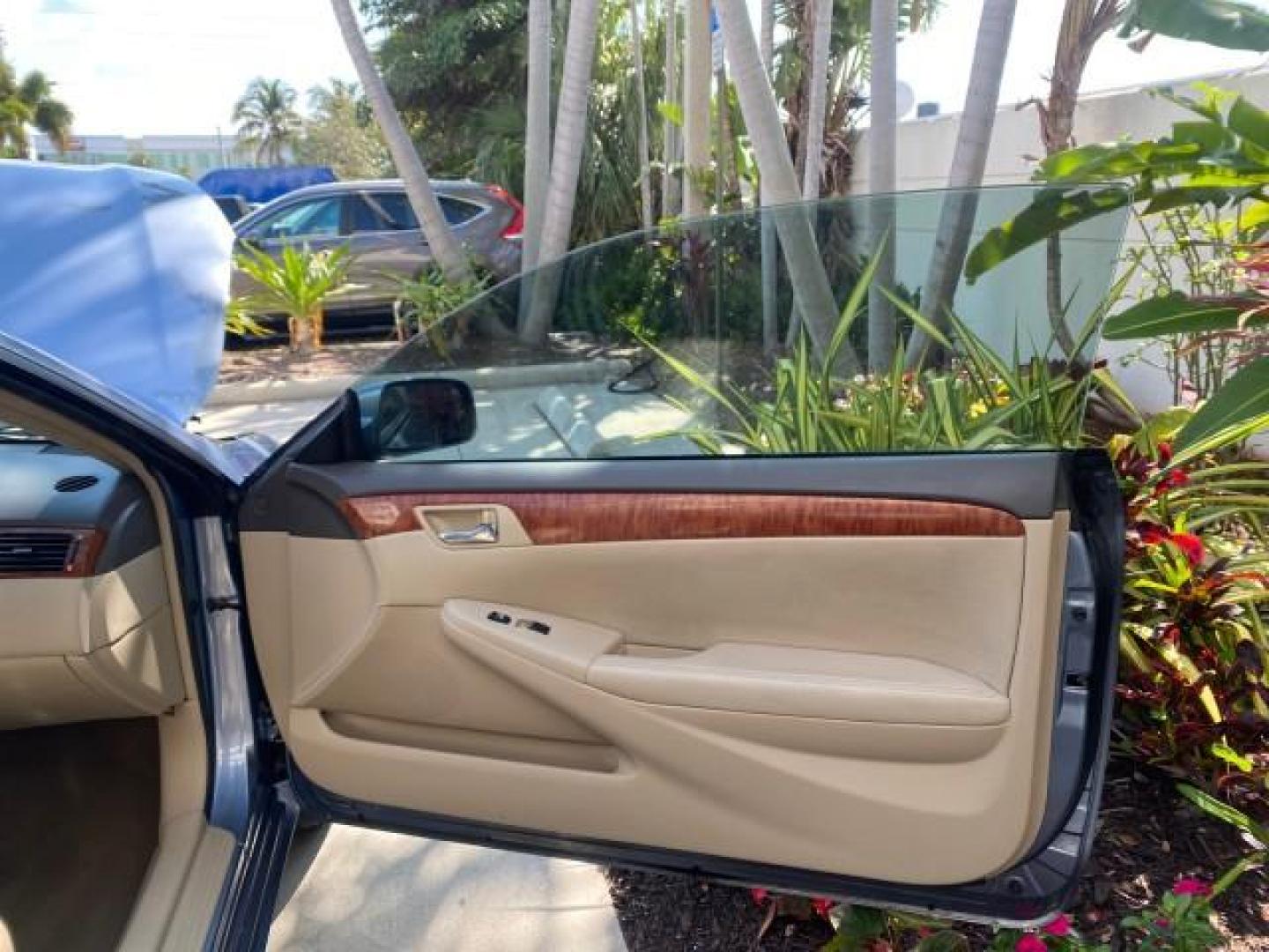 2007 Cosmic Blue Metallic /Ivory Toyota Camry Solara SLE LOW MILES 60,485 1 OWNER FL (4T1FA38P57U) with an 3.3L DOHC SMPI VVT-i 24-Valve V6 Engine engine, Automatic transmission, located at 4701 North Dixie Hwy, Pompano Beach, FL, 33064, (954) 422-2889, 26.240938, -80.123474 - OUR WEBPAGE FLORIDACARS1.COM HAS OVER 100 PHOTOS AND FREE CARFAX LINK 2007 Toyota Camry Solara SLE V6 1 OWNER FL Convertible 3.3L V6 F DOHC 24V Gasoline Front Wheel Drive Features ABS Brakes Air Conditioning Alloy Wheels AM/FM Stereo Automatic Transmission Auxiliary Audio Input Bluetooth Technology - Photo#11