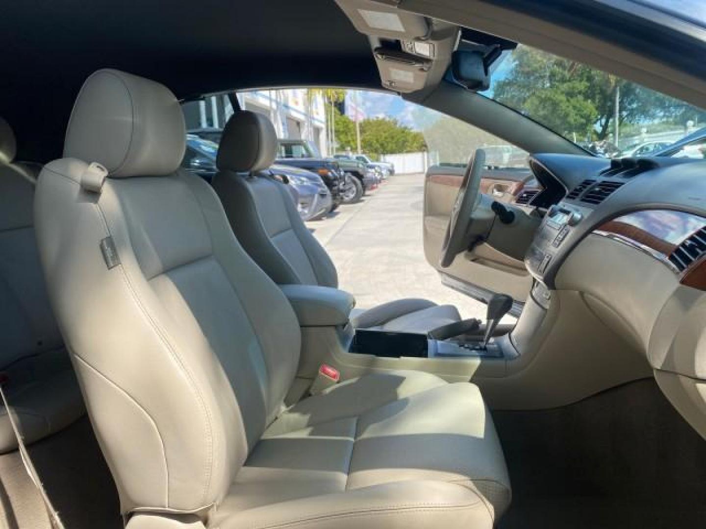 2007 Cosmic Blue Metallic /Ivory Toyota Camry Solara SLE LOW MILES 60,485 1 OWNER FL (4T1FA38P57U) with an 3.3L DOHC SMPI VVT-i 24-Valve V6 Engine engine, Automatic transmission, located at 4701 North Dixie Hwy, Pompano Beach, FL, 33064, (954) 422-2889, 26.240938, -80.123474 - OUR WEBPAGE FLORIDACARS1.COM HAS OVER 100 PHOTOS AND FREE CARFAX LINK 2007 Toyota Camry Solara SLE V6 1 OWNER FL Convertible 3.3L V6 F DOHC 24V Gasoline Front Wheel Drive Features ABS Brakes Air Conditioning Alloy Wheels AM/FM Stereo Automatic Transmission Auxiliary Audio Input Bluetooth Technology - Photo#12