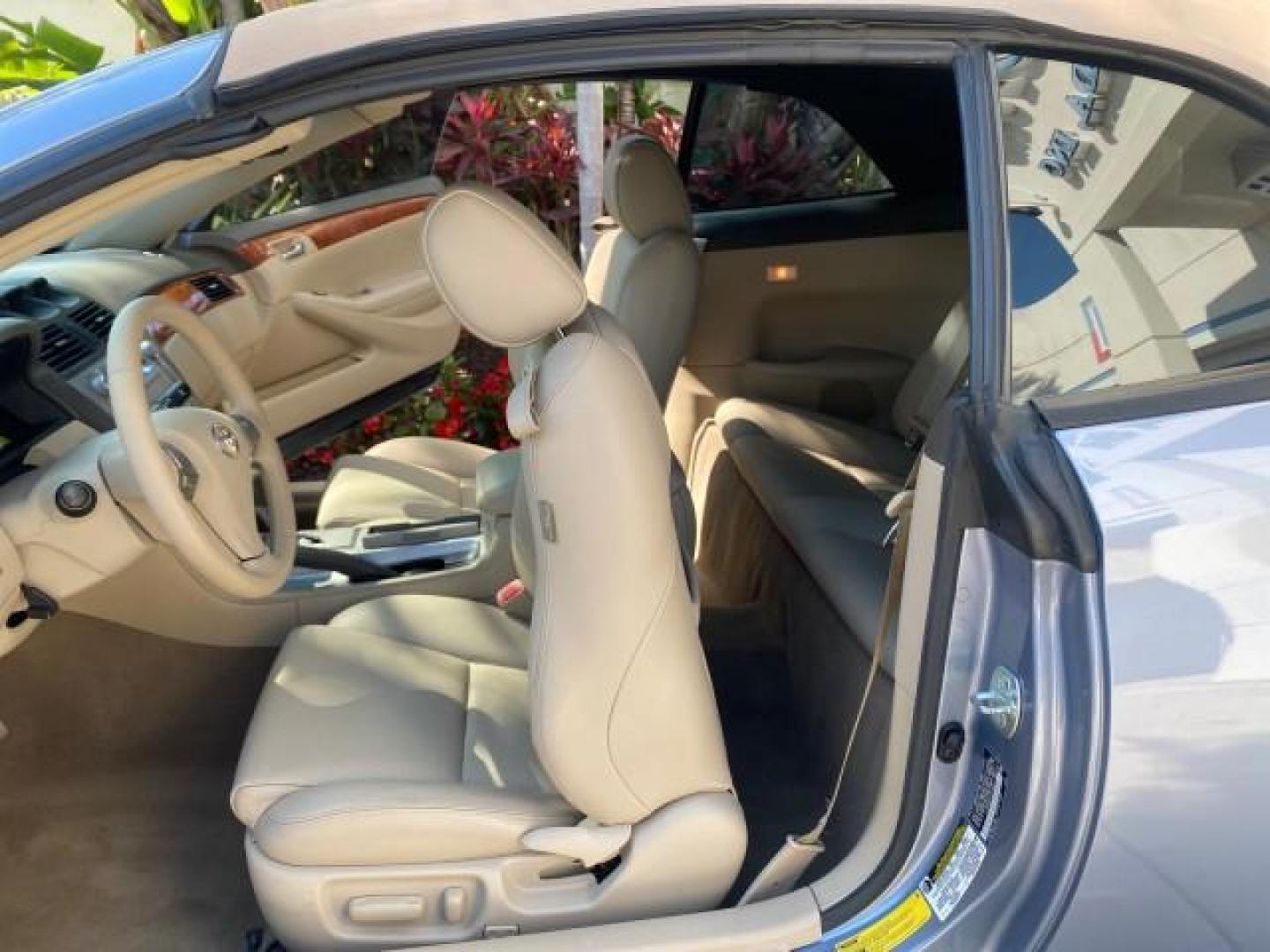 2007 Cosmic Blue Metallic /Ivory Toyota Camry Solara SLE LOW MILES 60,485 1 OWNER FL (4T1FA38P57U) with an 3.3L DOHC SMPI VVT-i 24-Valve V6 Engine engine, Automatic transmission, located at 4701 North Dixie Hwy, Pompano Beach, FL, 33064, (954) 422-2889, 26.240938, -80.123474 - OUR WEBPAGE FLORIDACARS1.COM HAS OVER 100 PHOTOS AND FREE CARFAX LINK 2007 Toyota Camry Solara SLE V6 1 OWNER FL Convertible 3.3L V6 F DOHC 24V Gasoline Front Wheel Drive Features ABS Brakes Air Conditioning Alloy Wheels AM/FM Stereo Automatic Transmission Auxiliary Audio Input Bluetooth Technology - Photo#13