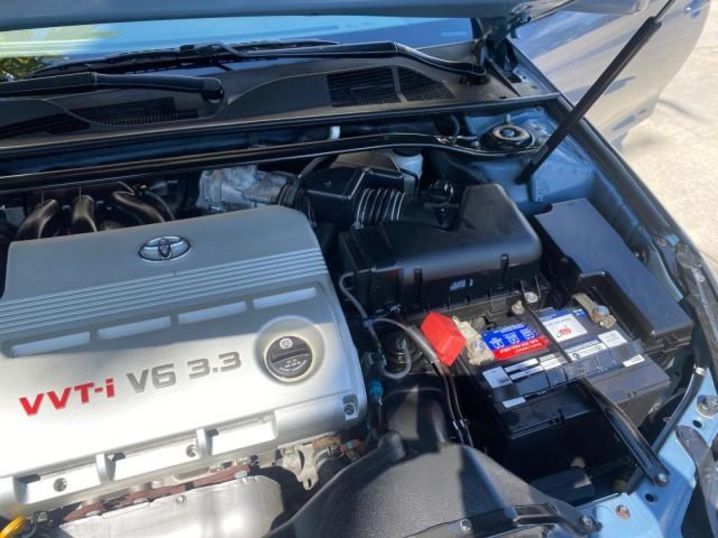 2007 Cosmic Blue Metallic /Ivory Toyota Camry Solara SLE LOW MILES 60,485 1 OWNER FL (4T1FA38P57U) with an 3.3L DOHC SMPI VVT-i 24-Valve V6 Engine engine, Automatic transmission, located at 4701 North Dixie Hwy, Pompano Beach, FL, 33064, (954) 422-2889, 26.240938, -80.123474 - OUR WEBPAGE FLORIDACARS1.COM HAS OVER 100 PHOTOS AND FREE CARFAX LINK 2007 Toyota Camry Solara SLE V6 1 OWNER FL Convertible 3.3L V6 F DOHC 24V Gasoline Front Wheel Drive Features ABS Brakes Air Conditioning Alloy Wheels AM/FM Stereo Automatic Transmission Auxiliary Audio Input Bluetooth Technology - Photo#25