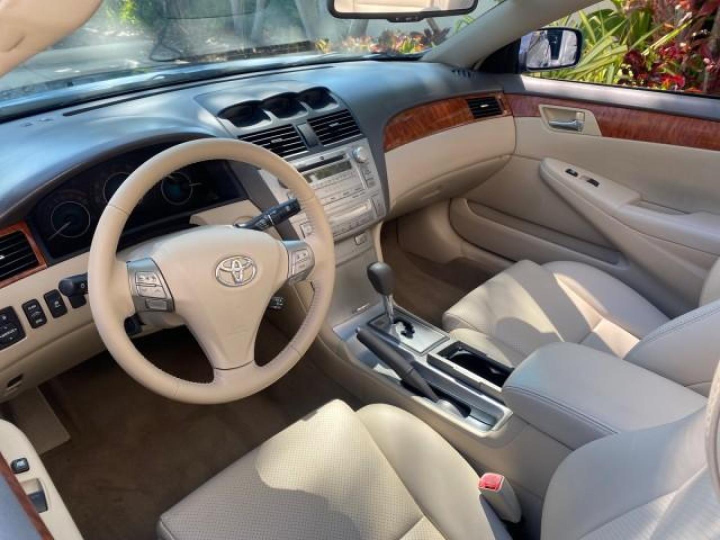 2007 Cosmic Blue Metallic /Ivory Toyota Camry Solara SLE LOW MILES 60,485 1 OWNER FL (4T1FA38P57U) with an 3.3L DOHC SMPI VVT-i 24-Valve V6 Engine engine, Automatic transmission, located at 4701 North Dixie Hwy, Pompano Beach, FL, 33064, (954) 422-2889, 26.240938, -80.123474 - OUR WEBPAGE FLORIDACARS1.COM HAS OVER 100 PHOTOS AND FREE CARFAX LINK 2007 Toyota Camry Solara SLE V6 1 OWNER FL Convertible 3.3L V6 F DOHC 24V Gasoline Front Wheel Drive Features ABS Brakes Air Conditioning Alloy Wheels AM/FM Stereo Automatic Transmission Auxiliary Audio Input Bluetooth Technology - Photo#49