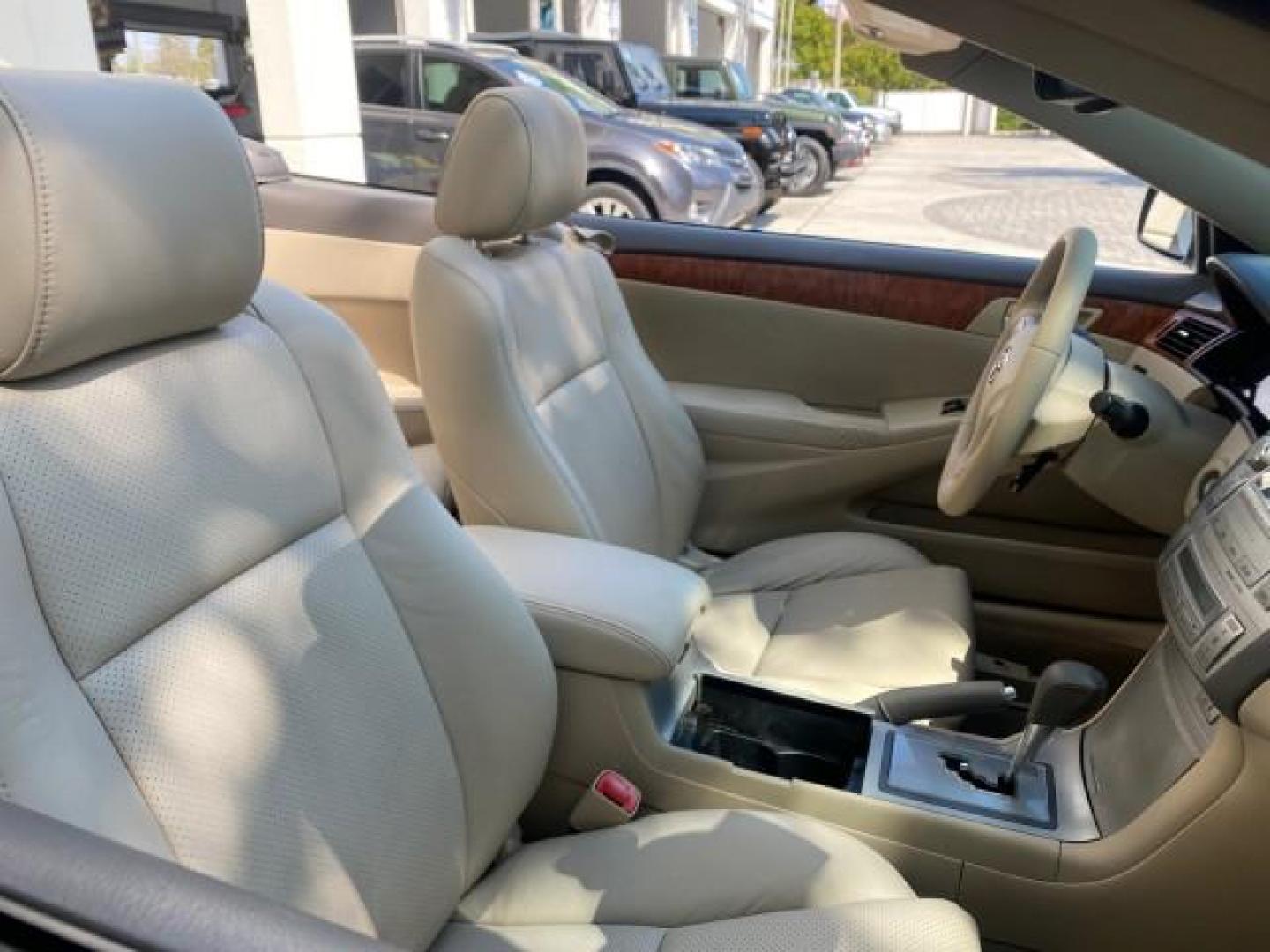 2007 Cosmic Blue Metallic /Ivory Toyota Camry Solara SLE LOW MILES 60,485 1 OWNER FL (4T1FA38P57U) with an 3.3L DOHC SMPI VVT-i 24-Valve V6 Engine engine, Automatic transmission, located at 4701 North Dixie Hwy, Pompano Beach, FL, 33064, (954) 422-2889, 26.240938, -80.123474 - OUR WEBPAGE FLORIDACARS1.COM HAS OVER 100 PHOTOS AND FREE CARFAX LINK 2007 Toyota Camry Solara SLE V6 1 OWNER FL Convertible 3.3L V6 F DOHC 24V Gasoline Front Wheel Drive Features ABS Brakes Air Conditioning Alloy Wheels AM/FM Stereo Automatic Transmission Auxiliary Audio Input Bluetooth Technology - Photo#51