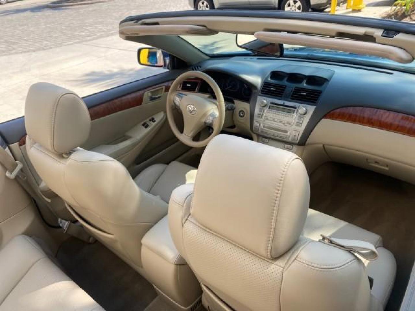 2007 Cosmic Blue Metallic /Ivory Toyota Camry Solara SLE LOW MILES 60,485 1 OWNER FL (4T1FA38P57U) with an 3.3L DOHC SMPI VVT-i 24-Valve V6 Engine engine, Automatic transmission, located at 4701 North Dixie Hwy, Pompano Beach, FL, 33064, (954) 422-2889, 26.240938, -80.123474 - OUR WEBPAGE FLORIDACARS1.COM HAS OVER 100 PHOTOS AND FREE CARFAX LINK 2007 Toyota Camry Solara SLE V6 1 OWNER FL Convertible 3.3L V6 F DOHC 24V Gasoline Front Wheel Drive Features ABS Brakes Air Conditioning Alloy Wheels AM/FM Stereo Automatic Transmission Auxiliary Audio Input Bluetooth Technology - Photo#55