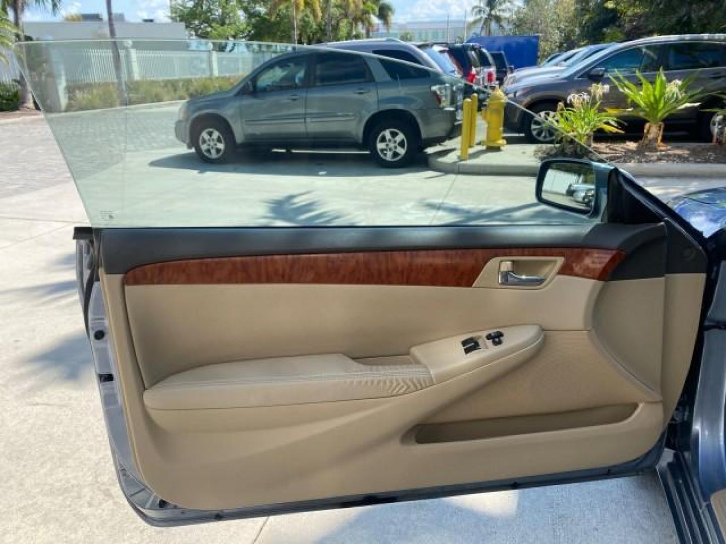 2007 Cosmic Blue Metallic /Ivory Toyota Camry Solara SLE LOW MILES 60,485 1 OWNER FL (4T1FA38P57U) with an 3.3L DOHC SMPI VVT-i 24-Valve V6 Engine engine, Automatic transmission, located at 4701 North Dixie Hwy, Pompano Beach, FL, 33064, (954) 422-2889, 26.240938, -80.123474 - OUR WEBPAGE FLORIDACARS1.COM HAS OVER 100 PHOTOS AND FREE CARFAX LINK 2007 Toyota Camry Solara SLE V6 1 OWNER FL Convertible 3.3L V6 F DOHC 24V Gasoline Front Wheel Drive Features ABS Brakes Air Conditioning Alloy Wheels AM/FM Stereo Automatic Transmission Auxiliary Audio Input Bluetooth Technology - Photo#60