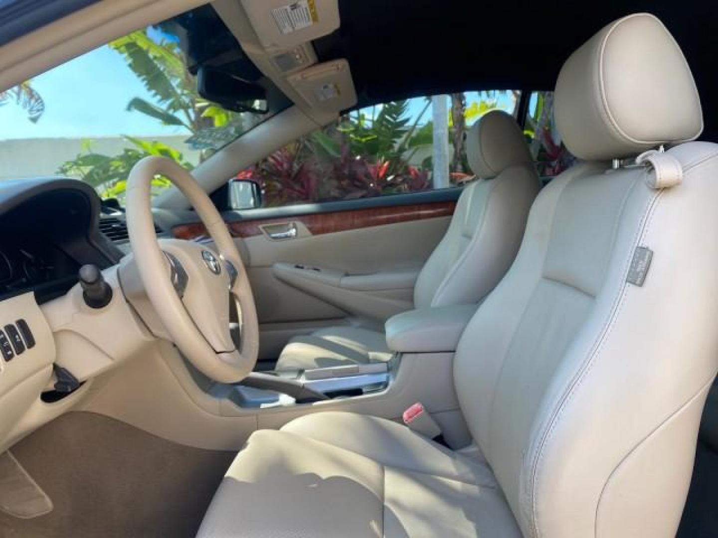 2007 Cosmic Blue Metallic /Ivory Toyota Camry Solara SLE LOW MILES 60,485 1 OWNER FL (4T1FA38P57U) with an 3.3L DOHC SMPI VVT-i 24-Valve V6 Engine engine, Automatic transmission, located at 4701 North Dixie Hwy, Pompano Beach, FL, 33064, (954) 422-2889, 26.240938, -80.123474 - OUR WEBPAGE FLORIDACARS1.COM HAS OVER 100 PHOTOS AND FREE CARFAX LINK 2007 Toyota Camry Solara SLE V6 1 OWNER FL Convertible 3.3L V6 F DOHC 24V Gasoline Front Wheel Drive Features ABS Brakes Air Conditioning Alloy Wheels AM/FM Stereo Automatic Transmission Auxiliary Audio Input Bluetooth Technology - Photo#63