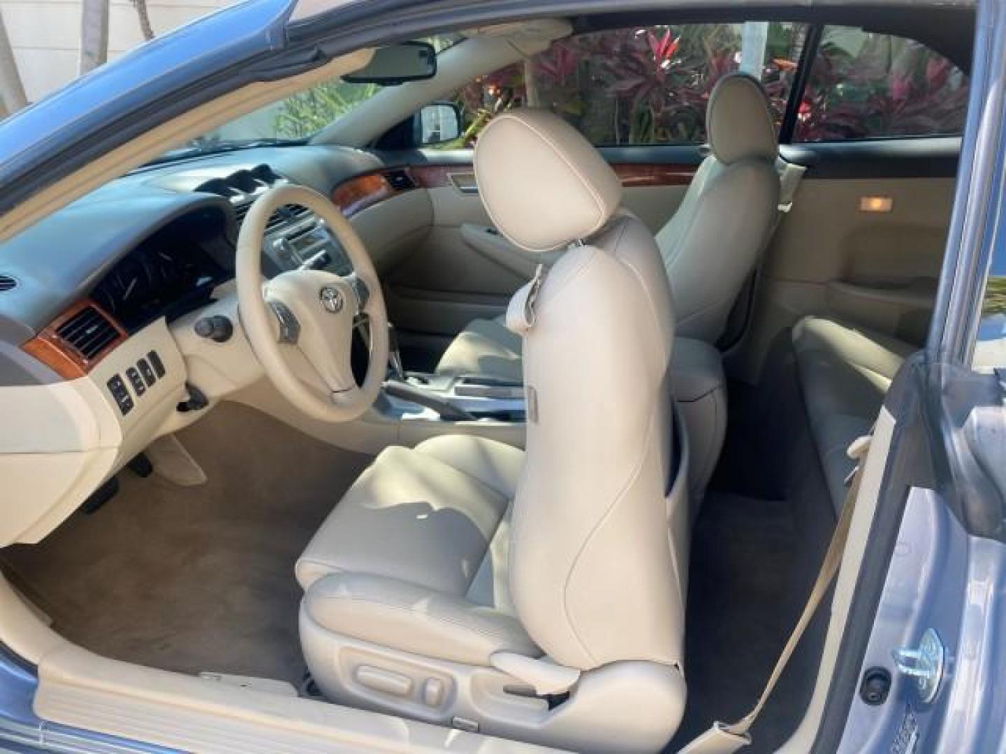 2007 Cosmic Blue Metallic /Ivory Toyota Camry Solara SLE LOW MILES 60,485 1 OWNER FL (4T1FA38P57U) with an 3.3L DOHC SMPI VVT-i 24-Valve V6 Engine engine, Automatic transmission, located at 4701 North Dixie Hwy, Pompano Beach, FL, 33064, (954) 422-2889, 26.240938, -80.123474 - OUR WEBPAGE FLORIDACARS1.COM HAS OVER 100 PHOTOS AND FREE CARFAX LINK 2007 Toyota Camry Solara SLE V6 1 OWNER FL Convertible 3.3L V6 F DOHC 24V Gasoline Front Wheel Drive Features ABS Brakes Air Conditioning Alloy Wheels AM/FM Stereo Automatic Transmission Auxiliary Audio Input Bluetooth Technology - Photo#89
