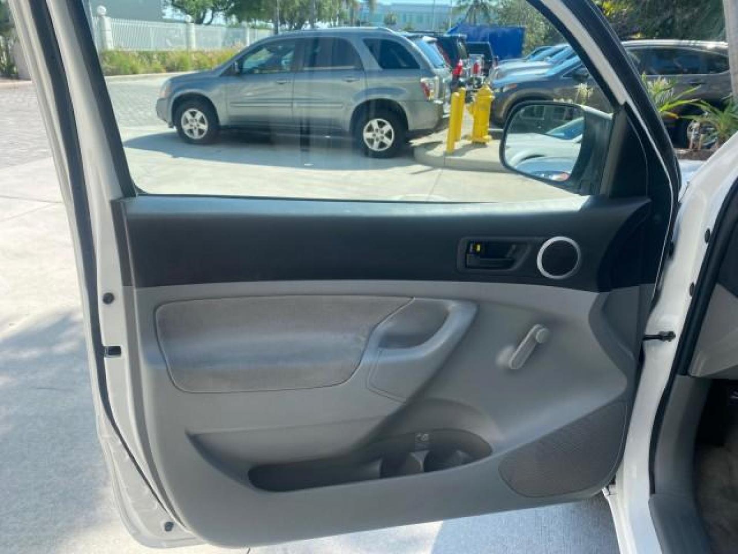 2007 Super White /Gray Toyota Tacoma LOW MILES 98,053 AUTO AC 4 CYL (5TENX22N77Z) with an 2.7L DOHC EFI 16-Valve I4 VVT-i Engine engine, Automatic transmission, located at 4701 North Dixie Hwy, Pompano Beach, FL, 33064, (954) 422-2889, 26.240938, -80.123474 - OUR WEBPAGE FLORIDACARS1.COM HAS OVER 100 PHOTOS AND FREE CARFAX LINK 2007 Toyota Tacoma VIN: 5TENX22N77Z369647 Pickup 2.7L I4 F DOHC 16V Gasoline 28 MPG Rear Wheel Drive Features ABS Brakes Air Conditioning AM/FM Stereo Automatic Transmission CD Audio Cloth Seats Cruise Control This incredible 2-ow- Photo#43