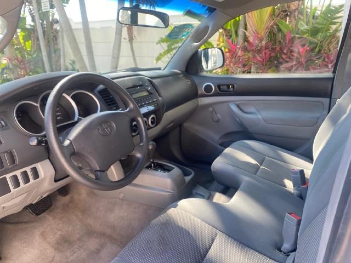 2007 Super White /Gray Toyota Tacoma LOW MILES 98,053 AUTO AC 4 CYL (5TENX22N77Z) with an 2.7L DOHC EFI 16-Valve I4 VVT-i Engine engine, Automatic transmission, located at 4701 North Dixie Hwy, Pompano Beach, FL, 33064, (954) 422-2889, 26.240938, -80.123474 - OUR WEBPAGE FLORIDACARS1.COM HAS OVER 100 PHOTOS AND FREE CARFAX LINK 2007 Toyota Tacoma VIN: 5TENX22N77Z369647 Pickup 2.7L I4 F DOHC 16V Gasoline 28 MPG Rear Wheel Drive Features ABS Brakes Air Conditioning AM/FM Stereo Automatic Transmission CD Audio Cloth Seats Cruise Control This incredible 2-ow- Photo#47