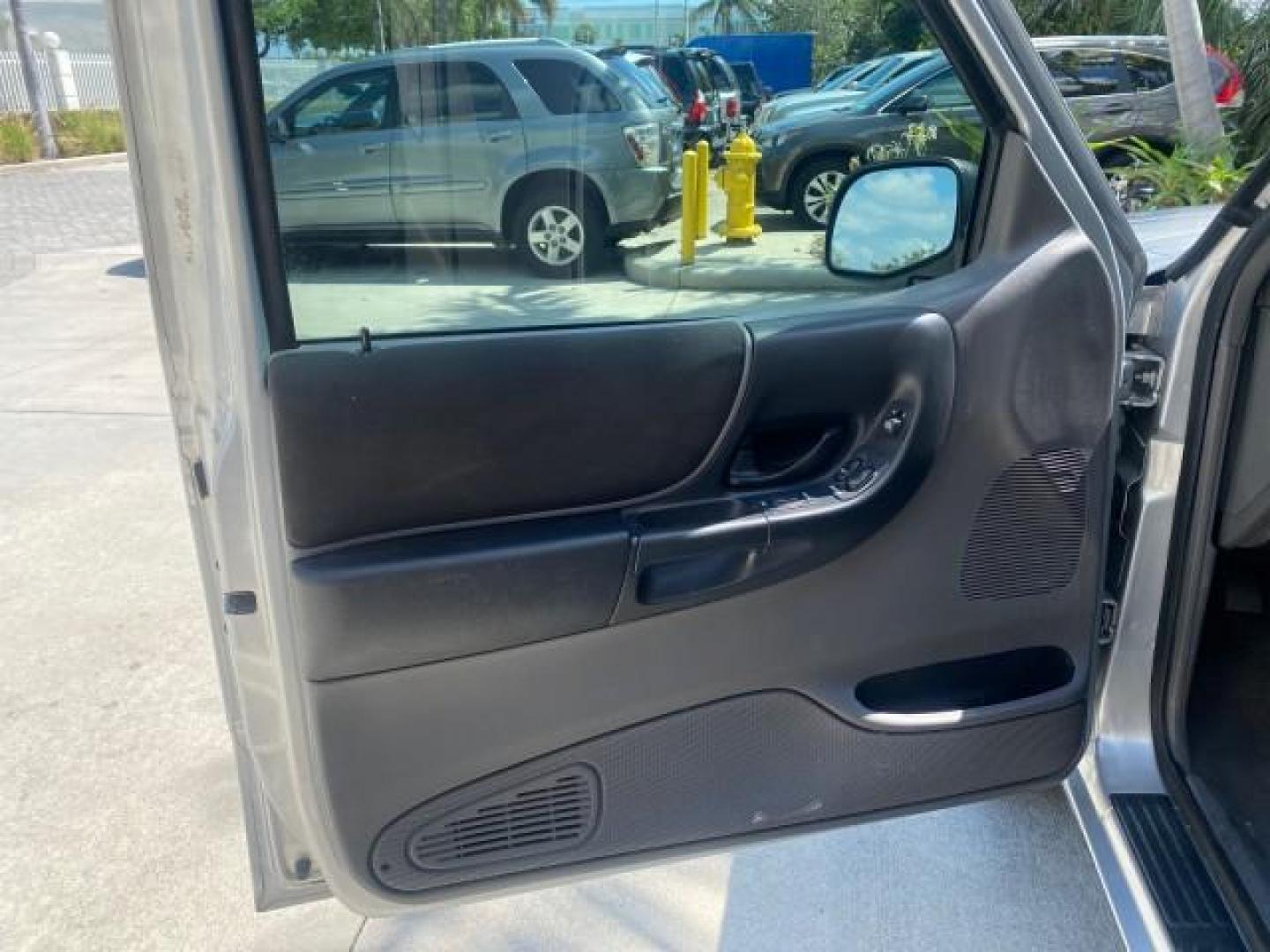 2003 Silver Frost Metallic /Dark Graphite Ford Ranger Edge Plus LOW MILES 57,781 X CAB (1FTYR44V93P) with an 3.0L SEFI Flex-Fuel FFV V6 Engine engine, Automatic transmission, located at 4701 North Dixie Hwy, Pompano Beach, FL, 33064, (954) 422-2889, 26.240938, -80.123474 - OUR WEBPAGE FLORIDACARS1.COM HAS OVER 100 PHOTOS AND FREE CARFAX LINK 2003 Ford Ranger XLT 4 Door Extended Cab Pickup 3.0L V6 F Flex Fuel 23 MPG Rear Wheel Drive Features ABS Brakes Air Conditioning Alloy Wheels AM/FM Stereo Automatic Transmission Bed Liner CD Audio Cloth Seats Cruise Control Flex F - Photo#41