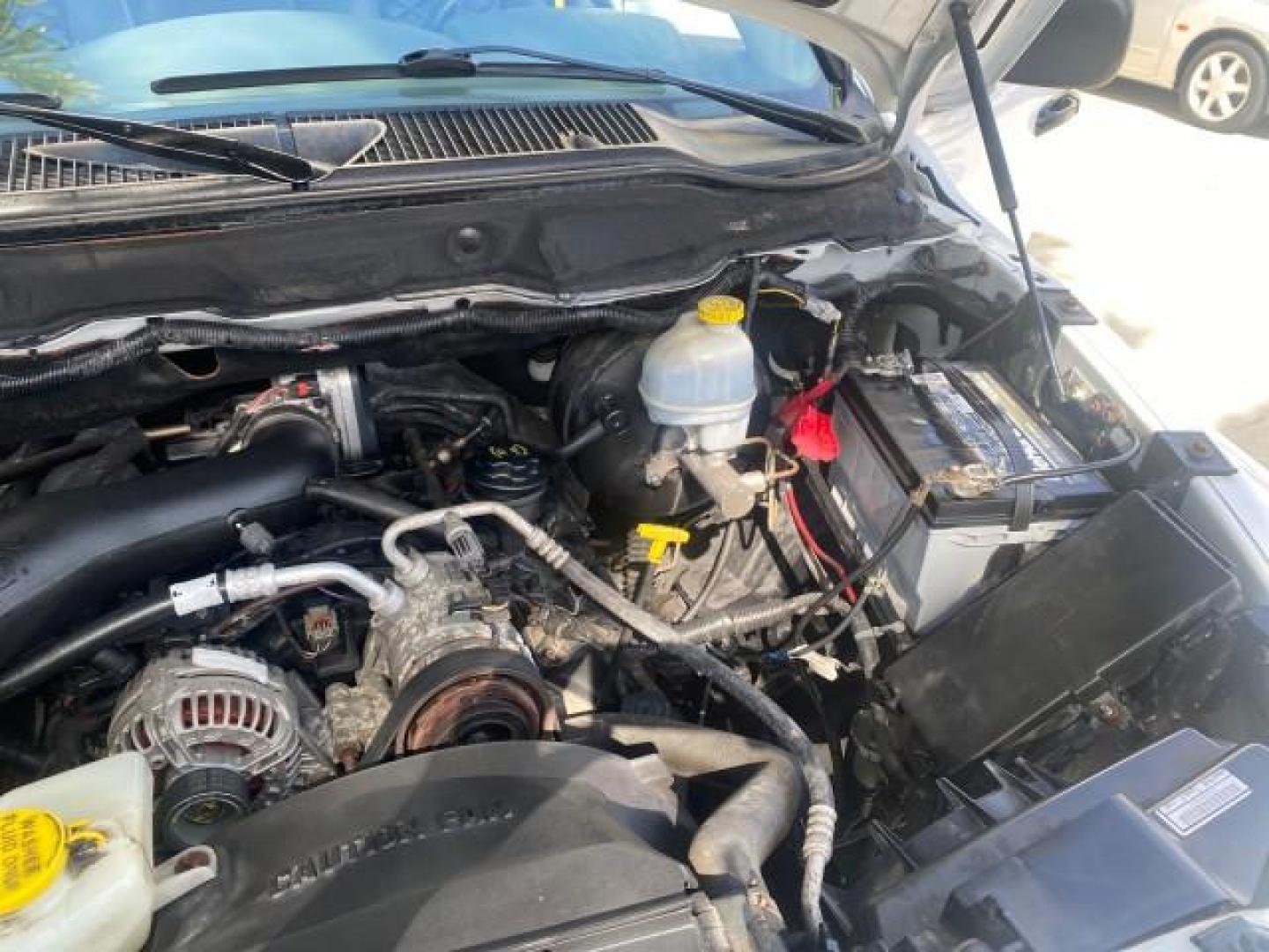 2007 Bright White /Medium Slate Gray Dodge Ram 1500 SLT CREW CAB CAMPER TOP 5.7 V8 (1D7HA182X7S) with an 5.7L V8 Hemi Multi-Displacement Engine engine, Automatic transmission, located at 4701 North Dixie Hwy, Pompano Beach, FL, 33064, (954) 422-2889, 26.240938, -80.123474 - OUR WEBPAGE FLORIDACARS1.COM HAS OVER 100 PHOTOS AND FREE CARFAX LINK 2007 Dodge Ram 1500 SLT 8 FT CREW CAB FIBER GLASS CAMPER TOP 4 Door Extended Cab Pickup 5.7L V8 F 16V Gasoline 19 MPG Rear Wheel Drive Features 20 Inch Plus Wheels ABS Brakes Air Conditioning Alloy Wheels AM/FM Stereo Automatic Tr- Photo#24