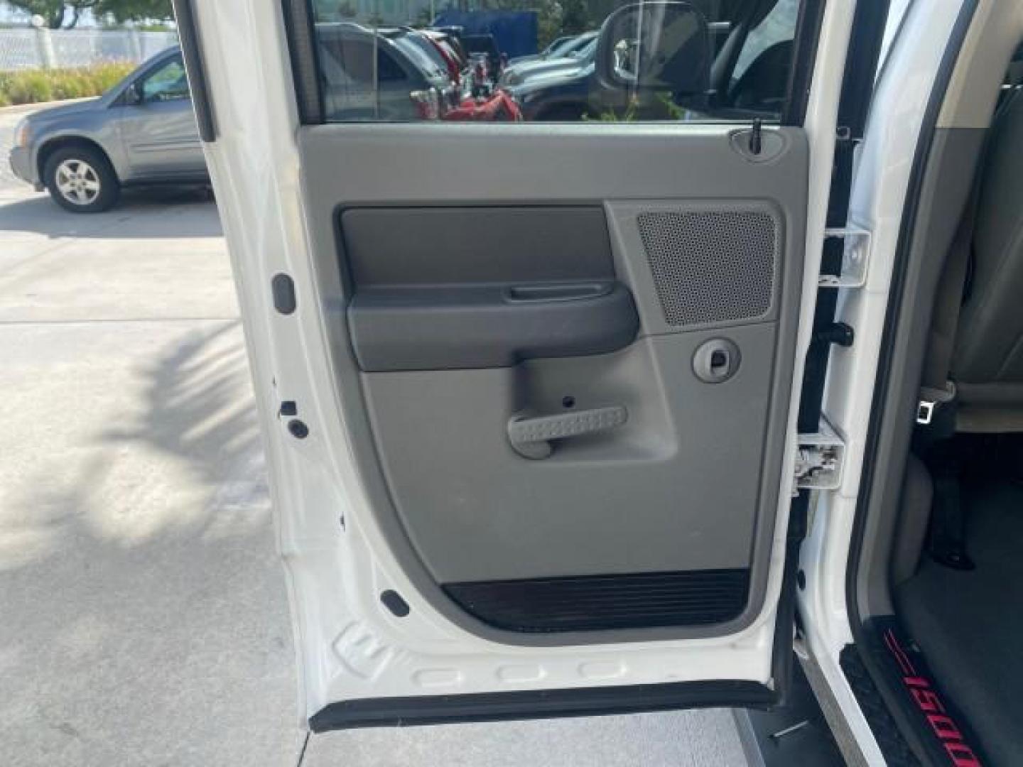 2007 Bright White /Medium Slate Gray Dodge Ram 1500 SLT CREW CAB CAMPER TOP 5.7 V8 (1D7HA182X7S) with an 5.7L V8 Hemi Multi-Displacement Engine engine, Automatic transmission, located at 4701 North Dixie Hwy, Pompano Beach, FL, 33064, (954) 422-2889, 26.240938, -80.123474 - OUR WEBPAGE FLORIDACARS1.COM HAS OVER 100 PHOTOS AND FREE CARFAX LINK 2007 Dodge Ram 1500 SLT 8 FT CREW CAB FIBER GLASS CAMPER TOP 4 Door Extended Cab Pickup 5.7L V8 F 16V Gasoline 19 MPG Rear Wheel Drive Features 20 Inch Plus Wheels ABS Brakes Air Conditioning Alloy Wheels AM/FM Stereo Automatic Tr- Photo#72