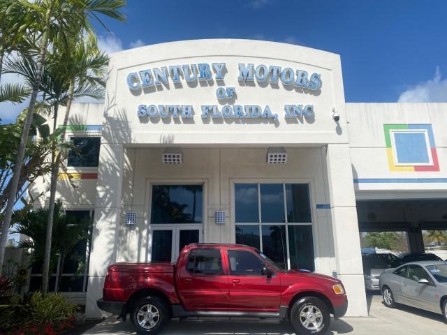2003 Red Fire Metallic /Medium Flint Ford Explorer Sport Trac XLT LOW MILES 59,213 (1FMZU67E23U) with an 4.0L SOHC MPFI V6 Engine engine, Automatic transmission, located at 4701 North Dixie Hwy, Pompano Beach, FL, 33064, (954) 422-2889, 26.240938, -80.123474 - OUR WEBPAGE FLORIDACARS1.COM HAS OVER 100 PHOTOS AND FREE CARFAX LINK 2003 Ford Explorer Sport Trac XLT Sport Pickup 4.0L V6 F SOHC Gasoline 21 MPG Rear Wheel Drive Features ABS Brakes Air Conditioning Alloy Wheels AM/FM Stereo Automatic Transmission Bed Cover Bed Liner CD Audio Cloth Seats Cruise C - Photo#0