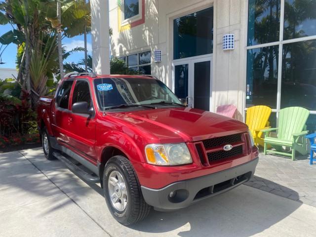2003 Red Fire Metallic /Medium Flint Ford Explorer Sport Trac XLT LOW MILES 59,213 (1FMZU67E23U) with an 4.0L SOHC MPFI V6 Engine engine, Automatic transmission, located at 4701 North Dixie Hwy, Pompano Beach, FL, 33064, (954) 422-2889, 26.240938, -80.123474 - OUR WEBPAGE FLORIDACARS1.COM HAS OVER 100 PHOTOS AND FREE CARFAX LINK 2003 Ford Explorer Sport Trac XLT Sport Pickup 4.0L V6 F SOHC Gasoline 21 MPG Rear Wheel Drive Features ABS Brakes Air Conditioning Alloy Wheels AM/FM Stereo Automatic Transmission Bed Cover Bed Liner CD Audio Cloth Seats Cruise C - Photo#1