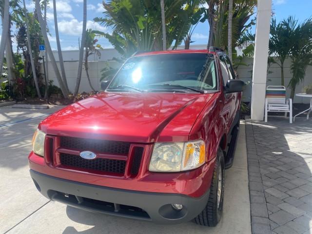 2003 Red Fire Metallic /Medium Flint Ford Explorer Sport Trac XLT LOW MILES 59,213 (1FMZU67E23U) with an 4.0L SOHC MPFI V6 Engine engine, Automatic transmission, located at 4701 North Dixie Hwy, Pompano Beach, FL, 33064, (954) 422-2889, 26.240938, -80.123474 - OUR WEBPAGE FLORIDACARS1.COM HAS OVER 100 PHOTOS AND FREE CARFAX LINK 2003 Ford Explorer Sport Trac XLT Sport Pickup 4.0L V6 F SOHC Gasoline 21 MPG Rear Wheel Drive Features ABS Brakes Air Conditioning Alloy Wheels AM/FM Stereo Automatic Transmission Bed Cover Bed Liner CD Audio Cloth Seats Cruise C - Photo#3