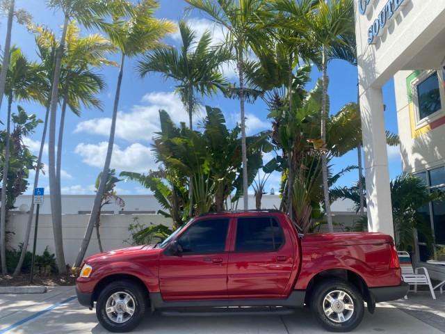 2003 Red Fire Metallic /Medium Flint Ford Explorer Sport Trac XLT LOW MILES 59,213 (1FMZU67E23U) with an 4.0L SOHC MPFI V6 Engine engine, Automatic transmission, located at 4701 North Dixie Hwy, Pompano Beach, FL, 33064, (954) 422-2889, 26.240938, -80.123474 - OUR WEBPAGE FLORIDACARS1.COM HAS OVER 100 PHOTOS AND FREE CARFAX LINK 2003 Ford Explorer Sport Trac XLT Sport Pickup 4.0L V6 F SOHC Gasoline 21 MPG Rear Wheel Drive Features ABS Brakes Air Conditioning Alloy Wheels AM/FM Stereo Automatic Transmission Bed Cover Bed Liner CD Audio Cloth Seats Cruise C - Photo#4