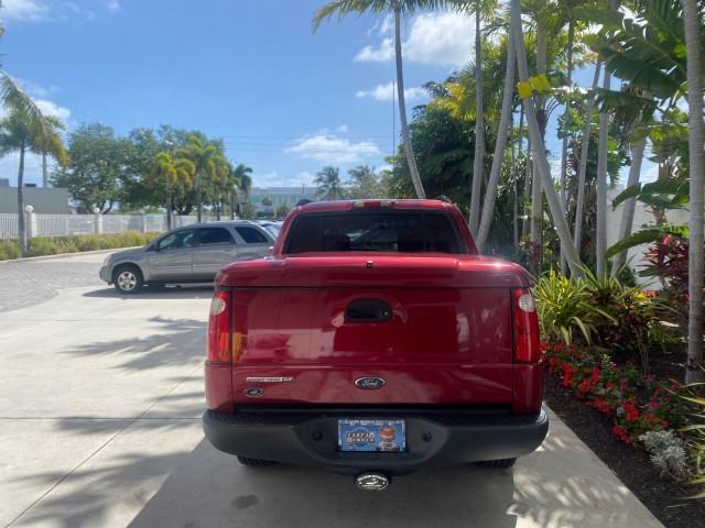 2003 Red Fire Metallic /Medium Flint Ford Explorer Sport Trac XLT LOW MILES 59,213 (1FMZU67E23U) with an 4.0L SOHC MPFI V6 Engine engine, Automatic transmission, located at 4701 North Dixie Hwy, Pompano Beach, FL, 33064, (954) 422-2889, 26.240938, -80.123474 - OUR WEBPAGE FLORIDACARS1.COM HAS OVER 100 PHOTOS AND FREE CARFAX LINK 2003 Ford Explorer Sport Trac XLT Sport Pickup 4.0L V6 F SOHC Gasoline 21 MPG Rear Wheel Drive Features ABS Brakes Air Conditioning Alloy Wheels AM/FM Stereo Automatic Transmission Bed Cover Bed Liner CD Audio Cloth Seats Cruise C - Photo#6