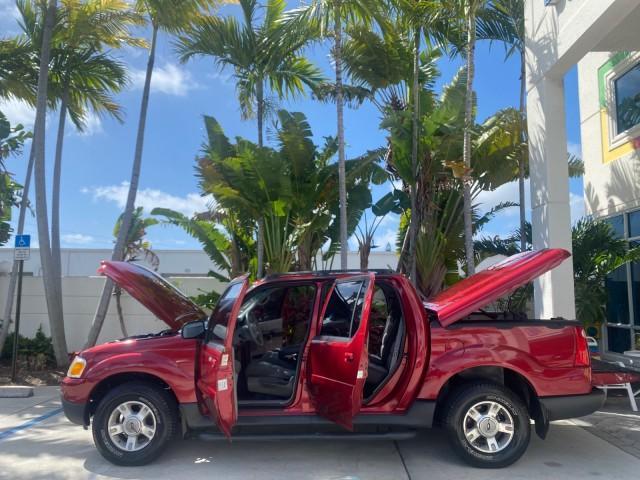 2003 Red Fire Metallic /Medium Flint Ford Explorer Sport Trac XLT LOW MILES 59,213 (1FMZU67E23U) with an 4.0L SOHC MPFI V6 Engine engine, Automatic transmission, located at 4701 North Dixie Hwy, Pompano Beach, FL, 33064, (954) 422-2889, 26.240938, -80.123474 - OUR WEBPAGE FLORIDACARS1.COM HAS OVER 100 PHOTOS AND FREE CARFAX LINK 2003 Ford Explorer Sport Trac XLT Sport Pickup 4.0L V6 F SOHC Gasoline 21 MPG Rear Wheel Drive Features ABS Brakes Air Conditioning Alloy Wheels AM/FM Stereo Automatic Transmission Bed Cover Bed Liner CD Audio Cloth Seats Cruise C - Photo#8