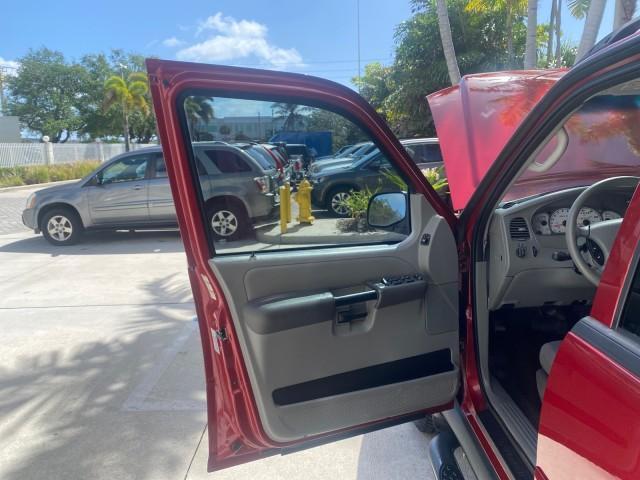 2003 Red Fire Metallic /Medium Flint Ford Explorer Sport Trac XLT LOW MILES 59,213 (1FMZU67E23U) with an 4.0L SOHC MPFI V6 Engine engine, Automatic transmission, located at 4701 North Dixie Hwy, Pompano Beach, FL, 33064, (954) 422-2889, 26.240938, -80.123474 - OUR WEBPAGE FLORIDACARS1.COM HAS OVER 100 PHOTOS AND FREE CARFAX LINK 2003 Ford Explorer Sport Trac XLT Sport Pickup 4.0L V6 F SOHC Gasoline 21 MPG Rear Wheel Drive Features ABS Brakes Air Conditioning Alloy Wheels AM/FM Stereo Automatic Transmission Bed Cover Bed Liner CD Audio Cloth Seats Cruise C - Photo#9