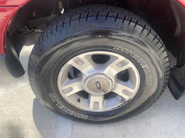 2003 Red Fire Metallic /Medium Flint Ford Explorer Sport Trac XLT LOW MILES 59,213 (1FMZU67E23U) with an 4.0L SOHC MPFI V6 Engine engine, Automatic transmission, located at 4701 North Dixie Hwy, Pompano Beach, FL, 33064, (954) 422-2889, 26.240938, -80.123474 - OUR WEBPAGE FLORIDACARS1.COM HAS OVER 100 PHOTOS AND FREE CARFAX LINK 2003 Ford Explorer Sport Trac XLT Sport Pickup 4.0L V6 F SOHC Gasoline 21 MPG Rear Wheel Drive Features ABS Brakes Air Conditioning Alloy Wheels AM/FM Stereo Automatic Transmission Bed Cover Bed Liner CD Audio Cloth Seats Cruise C - Photo#19