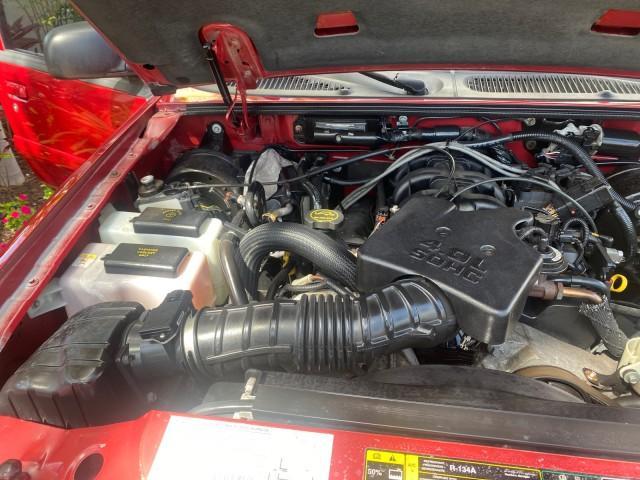 2003 Red Fire Metallic /Medium Flint Ford Explorer Sport Trac XLT LOW MILES 59,213 (1FMZU67E23U) with an 4.0L SOHC MPFI V6 Engine engine, Automatic transmission, located at 4701 North Dixie Hwy, Pompano Beach, FL, 33064, (954) 422-2889, 26.240938, -80.123474 - OUR WEBPAGE FLORIDACARS1.COM HAS OVER 100 PHOTOS AND FREE CARFAX LINK 2003 Ford Explorer Sport Trac XLT Sport Pickup 4.0L V6 F SOHC Gasoline 21 MPG Rear Wheel Drive Features ABS Brakes Air Conditioning Alloy Wheels AM/FM Stereo Automatic Transmission Bed Cover Bed Liner CD Audio Cloth Seats Cruise C - Photo#24