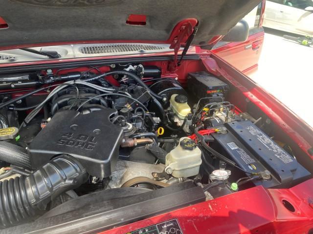 2003 Red Fire Metallic /Medium Flint Ford Explorer Sport Trac XLT LOW MILES 59,213 (1FMZU67E23U) with an 4.0L SOHC MPFI V6 Engine engine, Automatic transmission, located at 4701 North Dixie Hwy, Pompano Beach, FL, 33064, (954) 422-2889, 26.240938, -80.123474 - OUR WEBPAGE FLORIDACARS1.COM HAS OVER 100 PHOTOS AND FREE CARFAX LINK 2003 Ford Explorer Sport Trac XLT Sport Pickup 4.0L V6 F SOHC Gasoline 21 MPG Rear Wheel Drive Features ABS Brakes Air Conditioning Alloy Wheels AM/FM Stereo Automatic Transmission Bed Cover Bed Liner CD Audio Cloth Seats Cruise C - Photo#25